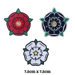 May include: Three embroidered iron-on patches featuring red, black, and white roses with green leaves. Each patch is 7.5 inches by 7.5 inches.