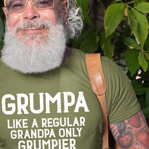 May include: A green t-shirt with white text that reads "Grumpa like a regular grandpa only grumpier".