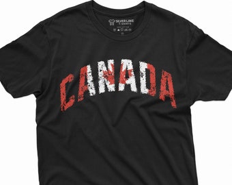 May include: Black t-shirt with a distressed white "CANADA" graphic featuring a red and white Canadian flag design.