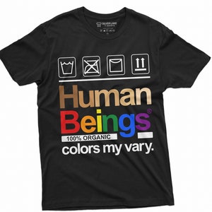 May include: Black t-shirt with a graphic of a clothing care label. The label says "Human Beings 100% Organic colors my vary."