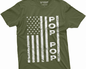 May include: A green t-shirt with a white distressed American flag design and the word "POP" repeated vertically down the right side of the flag.