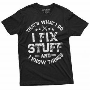 May include: Black t-shirt with a white distressed graphic that says "That's what I do I fix stuff and I know things".