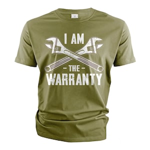 May include: A green t-shirt with a white graphic of two wrenches crossed over each other. The text "I AM - THE - WARRANTY" is printed on the shirt.