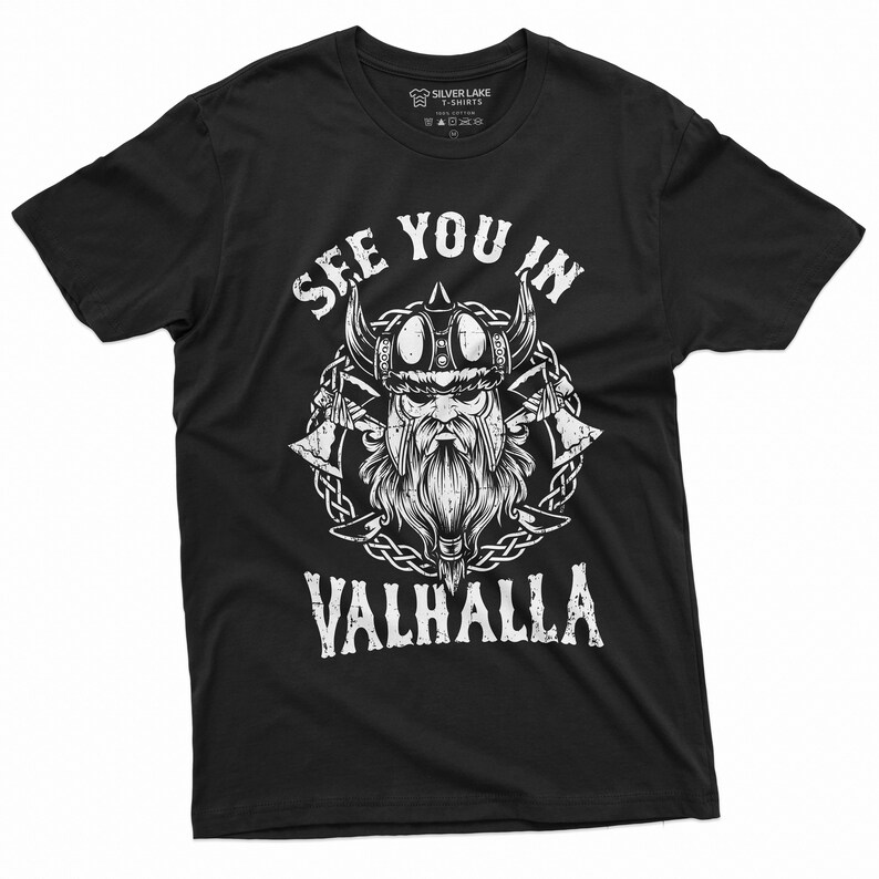 May include: Black t-shirt with a white graphic of a Viking warrior wearing a horned helmet, with the text "SEE YOU IN VALHALLA". The design includes crossed axes and a chain border. The shirt is from Silver Lake T-Shirts.