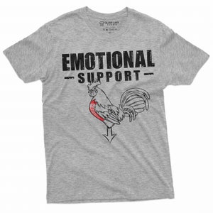 May include: A gray t-shirt with the text "Emotional Support" and a rooster illustration with a red heart on its chest.