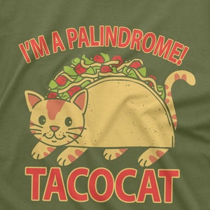 May include: A green t-shirt with a cat wearing a taco. The text "I'm a palindrome!" is above the cat and the text "tacocat" is below the cat.