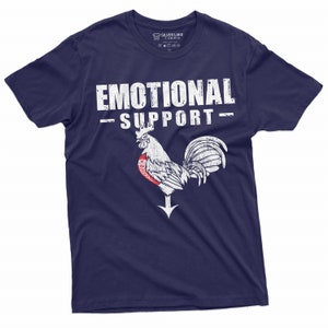 May include: A navy blue t-shirt with a white distressed graphic of a rooster and the text "Emotional Support".