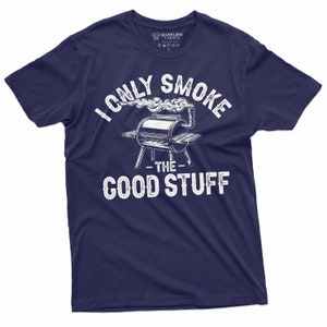 May include: Navy blue t-shirt with a white graphic of a grill with smoke coming out of it. The text "I only smoke the good stuff" is printed on the shirt.