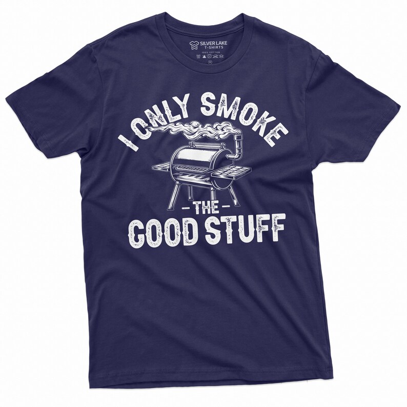 May include: Navy blue t-shirt with a white graphic of a grill with smoke coming out of it. The text "I only smoke the good stuff" is printed on the shirt.