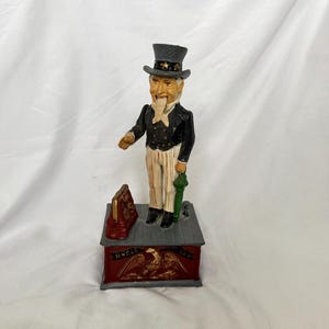 Banco Tio Sam de ferro fundido vintage