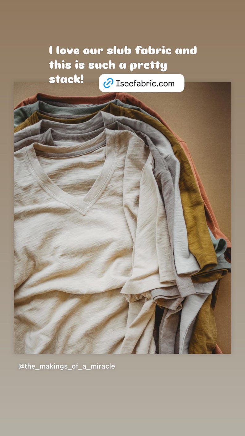 May include: A stack of folded, light-colored t-shirts in various shades of beige, gray, and brown. The shirts are made of a slub fabric, which gives them a textured look. The text "I love our slub fabric and this is such a pretty stack! Iseefabric.com" is at the top of the image. The text "@the_makings_of_a_miracle" is at the bottom of the image.