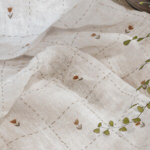Close-up view of Salt Air cotton gauze fabric showing its delicate double gauze construction and soft, puckered texture. This breathable cotton fabric is lightweight and gentle on the skin, making it perfect for baby items, loungewear, and warm-weather apparel. The fabric’s natural drape and airy weave are visible in soft folds, giving a relaxed, effortless look ideal for dresses, tops, scarves, and heirloom-quality sewing projects.