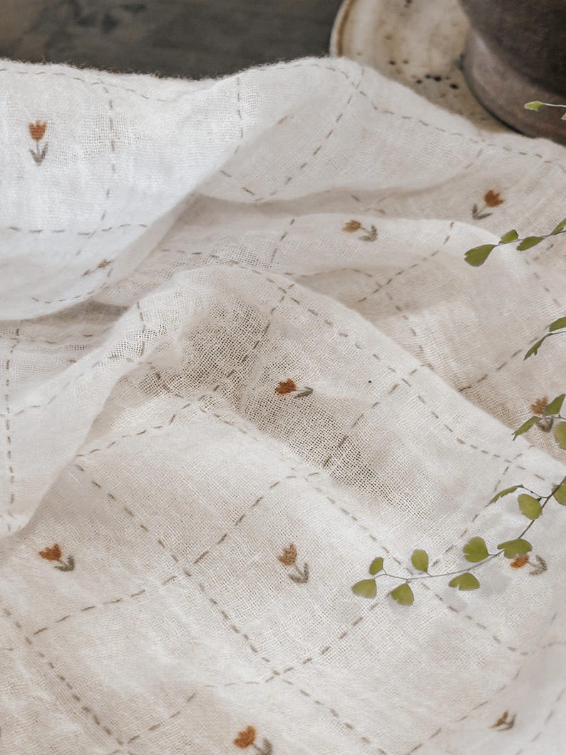 Close-up view of Salt Air cotton gauze fabric showing its delicate double gauze construction and soft, puckered texture. This breathable cotton fabric is lightweight and gentle on the skin, making it perfect for baby items, loungewear, and warm-weather apparel. The fabric’s natural drape and airy weave are visible in soft folds, giving a relaxed, effortless look ideal for dresses, tops, scarves, and heirloom-quality sewing projects.