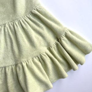 "Close-up of organic cotton sponge knit terry fabric, highlighting its soft, absorbent loops and breathable texture. Ideal for sewing sweatshirts, baby clothes, and cozy loungewear. The eco-friendly cotton ensures comfort and durability, making it perfect for handmade apparel and sustainable fashion."