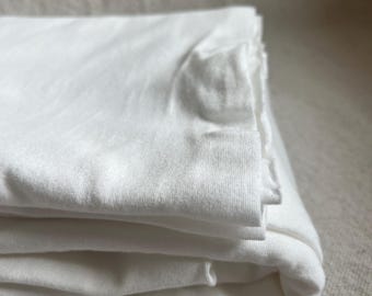 Tissu tricoté coton lycra biologique blanc, jersey doux et extensible dans 4 directions, coton et élasthanne pour t-shirts, leggings et vêtements de bébé