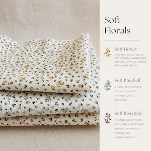 May include: Three folded pieces of white fabric with a small floral print. The top layer features yellow flowers, the middle layer has blue flowers, and the bottom layer displays pink flowers. Text on the right reads Soft Florals, Soft Honey, Soft Bluebell, and Soft Rosebud with descriptions.