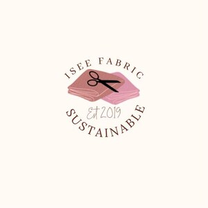 May include: Logo for a company called "I See Fabric Sustainable" featuring a pair of scissors cutting two pieces of pink fabric. The text "Est 2019" is below the fabric.