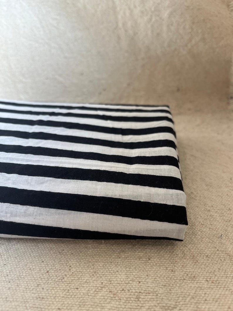 "Close-up of Carnival Cotton fabric, showcasing its vibrant colors and soft texture. Ideal for sewing dresses, blouses, quilting, and home décor. The breathable cotton ensures comfort, making it perfect for vintage-inspired and modern sewing projects."