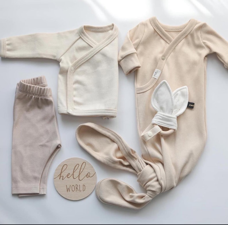 "Stacked organic cotton 2x1 rib knit fabric, showcasing its smooth, breathable texture and soft drape. Perfect for sewing t-shirts, dresses, and lounge sets. The natural cotton fibers provide a comfortable feel, making it a great choice for everyday wear and sustainable fashion."
