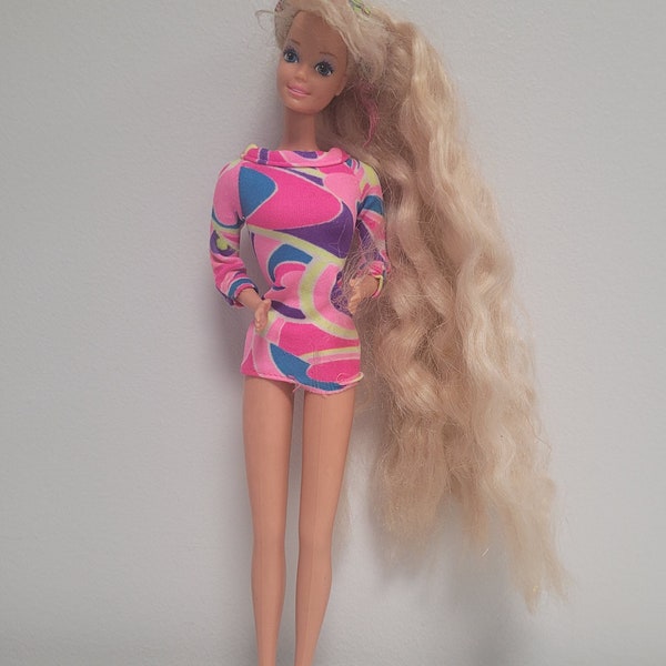 1991 Totally Hair Barbie. Sold individually -Barbie-Blonde and Teresa-Brown hair. Dolls in good condition.