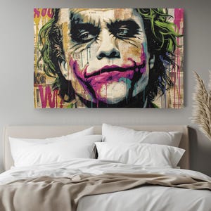 a painting of the joker on a wall above a bed