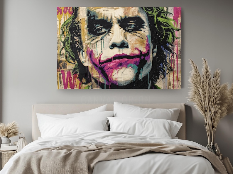 a painting of the joker on a wall above a bed
