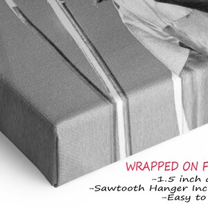 a black and white photo of a wrapped gift box