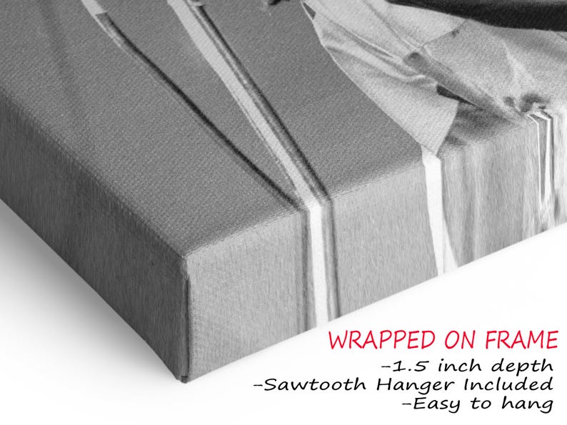 a black and white photo of a wrapped gift box