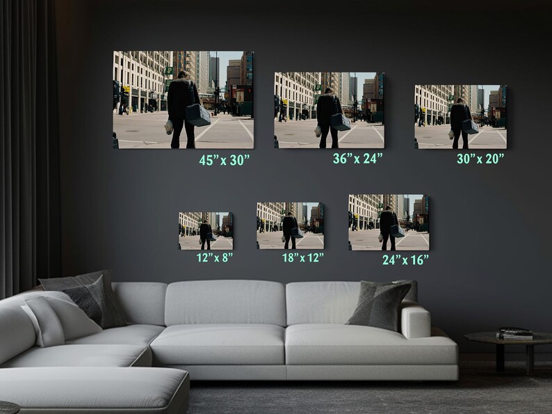 a living room filled with furniture and pictures on the wall