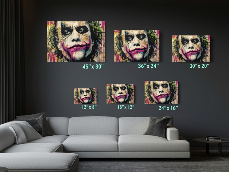 a living room with a couch and paintings on the wall