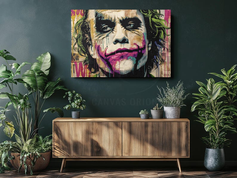 a painting of the joker on a green wall