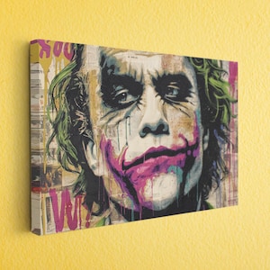 a painting of the joker on a yellow wall