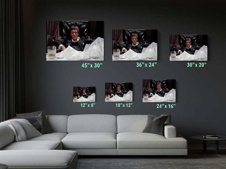 a living room filled with furniture and pictures on the wall