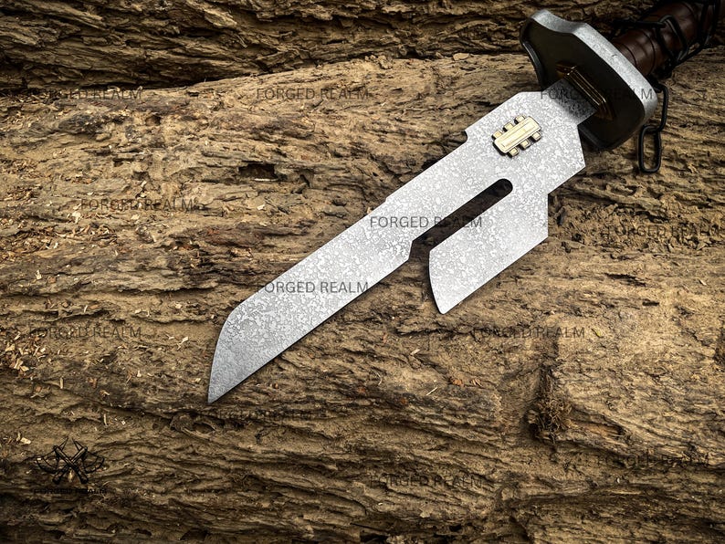 May include: A fixed-blade knife with a patterned steel blade featuring a cutout design and a small gold-colored rectangular inlay. The handle is dark brown with a metallic guard. The blade surface has a mottled texture and the text FORGED REALM.