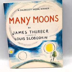 May include: A vintage book cover for "Many Moons" by James Thurber, illustrated by Louis Slobodkin. The cover features a night sky scene with a large white moon, several smaller moons, and a tree. The title is in red.
