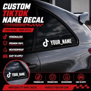 May include: A white vinyl decal featuring the TikTok logo and the text YOUR_NAME applied to a dark car window. The graphic includes the text CUSTOM TIKTOK NAME DECAL, YOUR NAME, YOUR STYLE, PERSONALIZED, PREMIUM VINYL, WEATHERPROOF, and EASY TO APPLY.