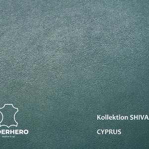 May include: A close-up of a teal leather texture with the text "Kollection SHIVA CYPRUS" in white.
