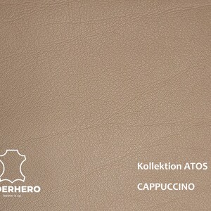 May include: A close-up of a light brown leather swatch with the text "Kollektion ATOS CAPPUCCINO" in white.