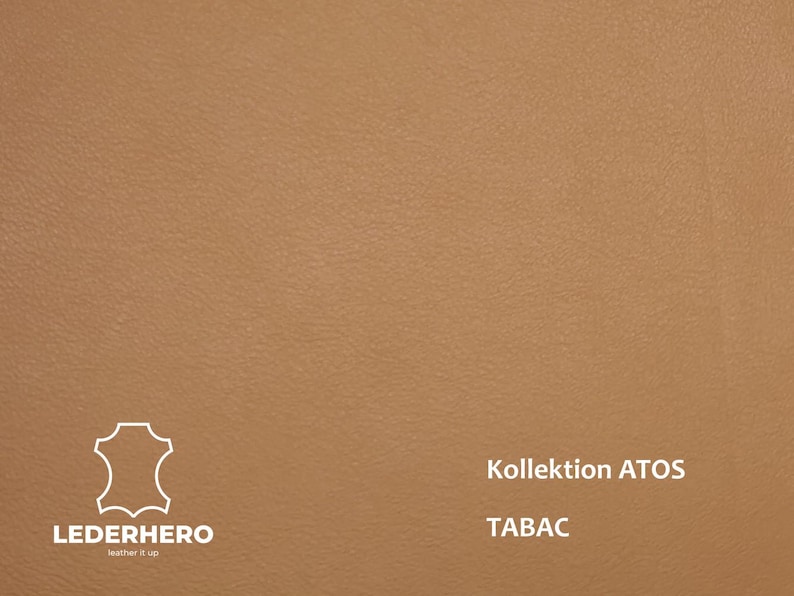 May include: Tan leather material with a subtle texture. The image includes the text "Kollektion ATOS" and "TABAC". The "LEDERHERO" logo is also visible in the lower left corner.