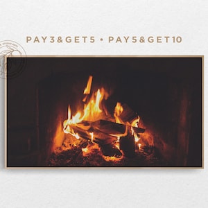 May include: A close-up of a fireplace with a roaring fire. The flames are orange and yellow, and the logs are burning brightly. The fireplace is surrounded by a dark brick wall.