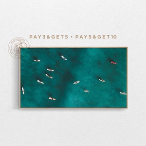 May include: Aerial view of a turquoise body of water with multiple people on paddleboards. The text "PAY 3 & GET 5 • PAY 5 & GET 10" is at the top of the image.