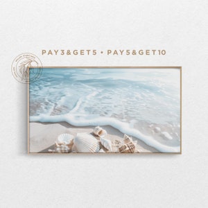 May include: A framed photograph of seashells on a sandy beach with foamy ocean waves in the background. The text "PAY 3 & GET 5 • PAY 5 & GET 10" is printed at the top of the image.