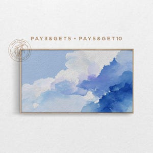 May include: A framed watercolor painting featuring a sky scene with shades of blue and white. The artwork depicts fluffy clouds and a gradient of blues, from light to deep. The text "PAY 3&GET 5 • PAY 5&GET 10" is visible at the top.