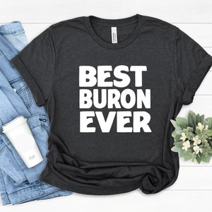 May include: A dark grey t-shirt with white text that reads "BEST BURON EVER".