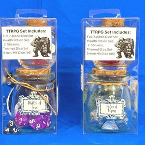 May include: Two glass potion bottles with cork stoppers, each containing dice sets for tabletop role-playing games. One bottle has purple dice and the label reads "Philler of Love." The other has blue dice and the label reads "Potion of Flying."