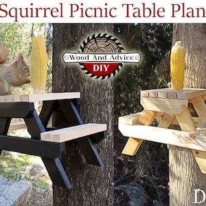 May include: Two DIY squirrel picnic tables mounted on trees. One table is painted black with a natural wood top and bench. The other table is made of natural wood. Both tables have corn on the cob on top.