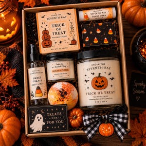 May include: A Halloween gift box containing a Trick or Treat soap, candy corn lip balm, a small box with candy corn print, a Sweet Treats body spray, a Sugar Cookie body butter, a bath bomb, a Trick or Treat candle, and a ghost card.