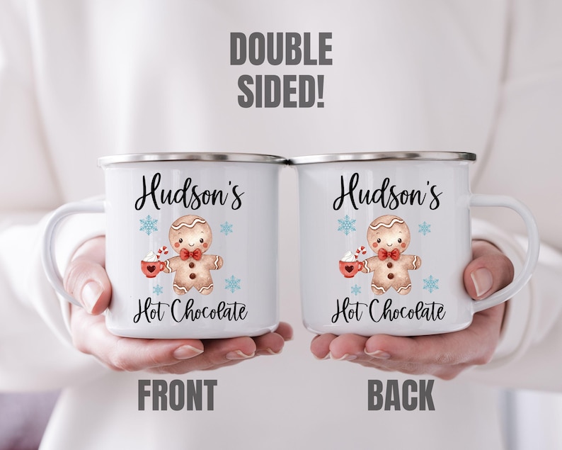 Puede incluir: Taza de esmalte blanco con un gr&aacute;fico de hombre de jengibre y el texto "Hudson's Hot Chocolate". La taza es de doble cara y presenta el mismo dise&ntilde;o en ambos lados.