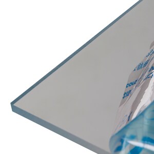 May include: A clear sheet of acrylic plastic with a blue protective film partially peeled back. The film has text in Japanese and English, including "Cold Side Up" and "1353-30C".
