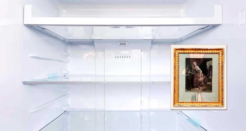 May include: An empty white refrigerator with a gold framed picture of a woman in a dress holding a child on the right side of the door.